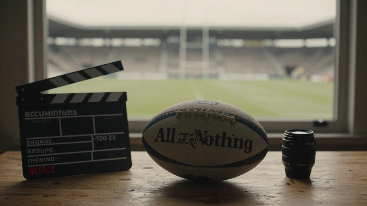 Rugby ball and film equipment on table with empty stadium in background